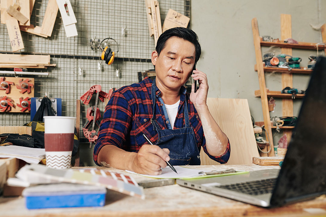 Woodworking man at desk